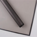 Roll of black plastic sheeting on a white background