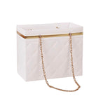 White clutch bag with gold chain strap on a white background